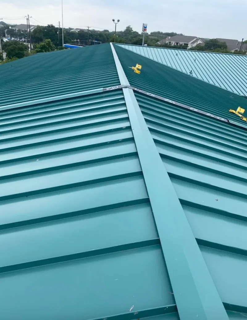Green commercial metal roof ridge and valley for Metal Roof Repair in Ashtabula